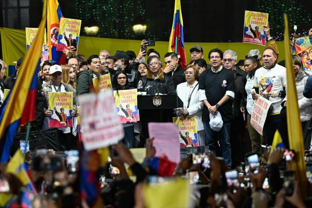 Colombia’s President Gustavo Petro sings the national anthem during the March for Sovereignty and Democracy against US President Donald Trump’s threats to Petro at Bolivar Square in Bogota on January 7, 2026. Donald Trump held his first phone call with Colombian counterpart Gustavo Petro on January 7, the foreign ministry in Bogota said, days after the US President threatened him with military action. (Photo by Luis ACOSTA / AFP)