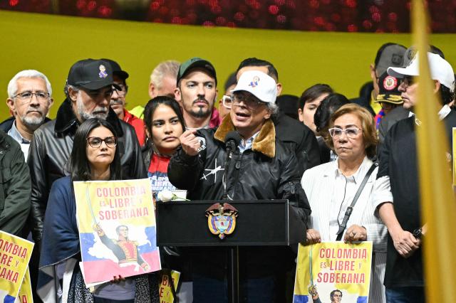 Colombia’s President Gustavo Petro sings the national anthem during the March for Sovereignty and Democracy against US President Donald Trump’s threats to Petro at Bolivar Square in Bogota on January 7, 2026. Donald Trump held his first phone call with Colombian counterpart Gustavo Petro on January 7, the foreign ministry in Bogota said, days after the US President threatened him with military action. (Photo by Luis ACOSTA / AFP)