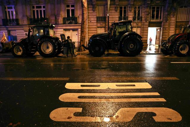 Tractors are parked near the Eiffel Tower during a demonstration by the French farmers union FDSEA Ile de France as part of a nationwide day of protests and actions called by several farmers unions to push the French government to block the Mercosur trade deal and protest against its handling of the nodular dermatitis (CND) epidemic, in Paris on January 8, 2026. (Photo by Thomas SAMSON / AFP)