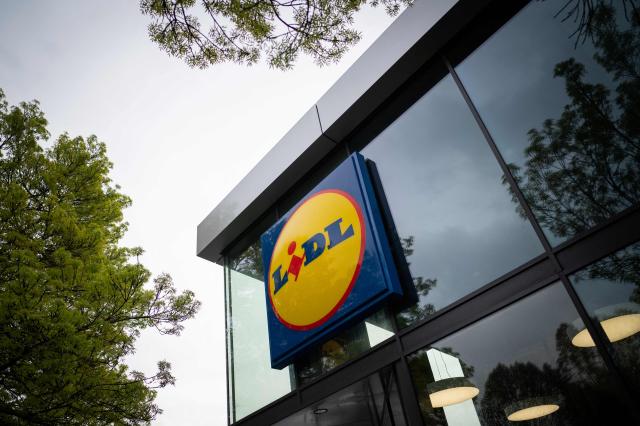 (FILES) This picture taken in Nantes, on March 31, 2022, shows a logo at the entrance of a Lidl discount supermarket. German hard discount food retailer Lidl announced on January 8, 2026 it would halt spots on broadcast television in France, where it is one of the country's top advertisers. (Photo by Loic VENANCE / AFP)