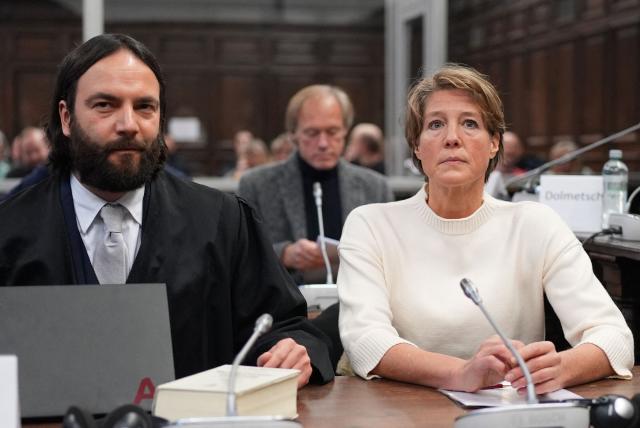 Defendant German entrepreneur and gastronome Christina Block (R) looks on next to her lawyer Ingo Bott as they wait for the continuation of the trial against Christina Block over alleged child abduction at the District Court in Hamburg, northern Germany, on January 8, 2026. The public prosecutor's office accuses Block, heiress of a steakhouse chain, of ordering the abduction of her daughter, born in 2010, and her son, born in 2013. According to the indictment, the background to this is an escalating custody dispute over many years between Block and her former husband, who have four children together. The latter kept the two youngest children with him in August 2021 after an agreed visit to Gravenstein in southern Denmark near the German border, where he had been living for some time. (Photo by Marcus Brandt / POOL / AFP)