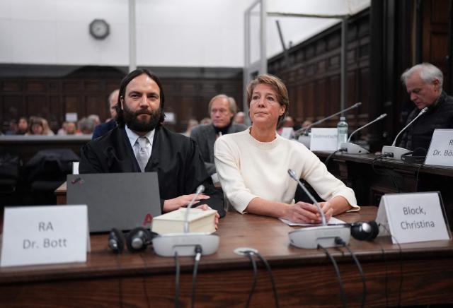 Defendant German entrepreneur and gastronome Christina Block (R) looks on next to her lawyer Ingo Bott as they wait for the continuation of the trial against Christina Block over alleged child abduction at the District Court in Hamburg, northern Germany, on January 8, 2026. The public prosecutor's office accuses Block, heiress of a steakhouse chain, of ordering the abduction of her daughter, born in 2010, and her son, born in 2013. According to the indictment, the background to this is an escalating custody dispute over many years between Block and her former husband, who have four children together. The latter kept the two youngest children with him in August 2021 after an agreed visit to Gravenstein in southern Denmark near the German border, where he had been living for some time. (Photo by Marcus Brandt / POOL / AFP)
