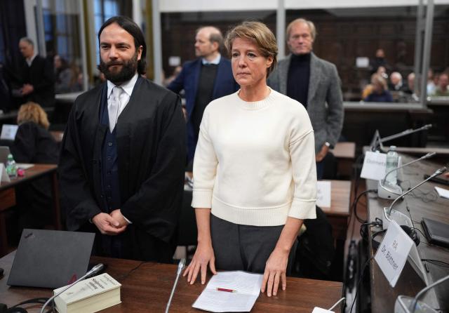 Defendant German entrepreneur and gastronome Christina Block (R) looks on next to her lawyer Ingo Bott in front of German former sports journalist Gerhard Delling as they wait for the continuation of the trial against Christina Block over alleged child abduction at the District Court in Hamburg, northern Germany, on January 8, 2026. The public prosecutor's office accuses Block, heiress of a steakhouse chain, of ordering the abduction of her daughter, born in 2010, and her son, born in 2013. According to the indictment, the background to this is an escalating custody dispute over many years between Block and her former husband, who have four children together. The latter kept the two youngest children with him in August 2021 after an agreed visit to Gravenstein in southern Denmark near the German border, where he had been living for some time. (Photo by Marcus Brandt / POOL / AFP)