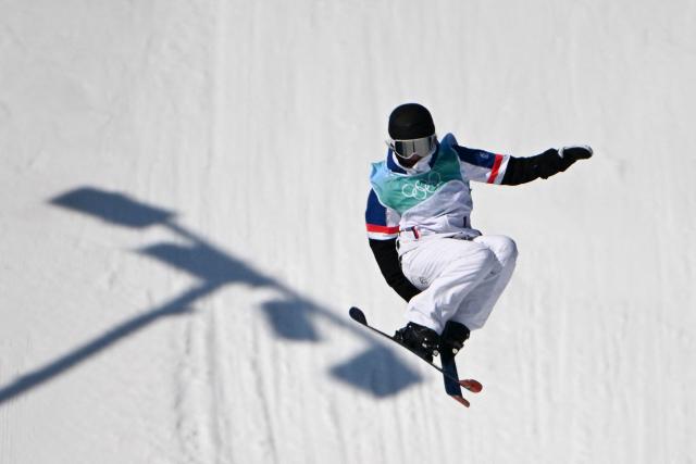 (FILES) France's Tess Ledeux competes in the freestyle skiing women's freeski big air final run during the Beijing 2022 Winter Olympic Games at the Big Air Shougang in Beijing on February 8, 2022. Tess Ledeux, who has been off the slopes since March 2025 due to a concussion, is still injured and has withdrawn from the Milan-Cortina Olympics (6-22 February), she announced at a press conference on January 8, 2026. (Photo by Manan VATSYAYANA / AFP)
