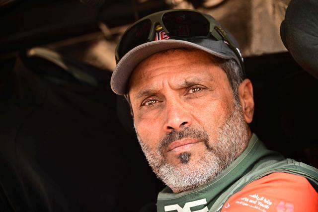 The Dacia Sandriders’s Qatari driver Nasser al-Attiyah sits in his cars at the end of  the Stage 4, a Marathon stage, of the 48th edition of the Dakar Rally 2026, between Al-Ula and Al-Ula, Saudi Arabia, on January 7, 2026. (Photo by Giuseppe CACACE / AFP)
