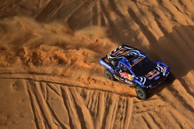 Ford Racing’s Spanish driver Nani Roma and Spanish copilot Alex Haro compete in the Stage 4, a Marathon stage, of the 48th edition of the Dakar Rally 2026, between Al-Ula and Al-Ula, Saudi Arabia, on January 7, 2026. (Photo by Giuseppe CACACE / AFP)