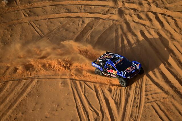 Ford Racing’s Spanish driver Nani Roma and Spanish copilot Alex Haro compete in the Stage 4, a Marathon stage, of the 48th edition of the Dakar Rally 2026, between Al-Ula and Al-Ula, Saudi Arabia, on January 7, 2026. (Photo by Giuseppe CACACE / AFP)
