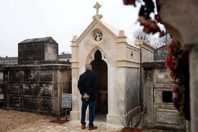 A man stands in front of the tomb of  late French Socialist president Francois Mitterrand during a ceremony marking the 30th anniversary of his death, in January 8, 2026. (Photo by ROMAIN PERROCHEAU / AFP)