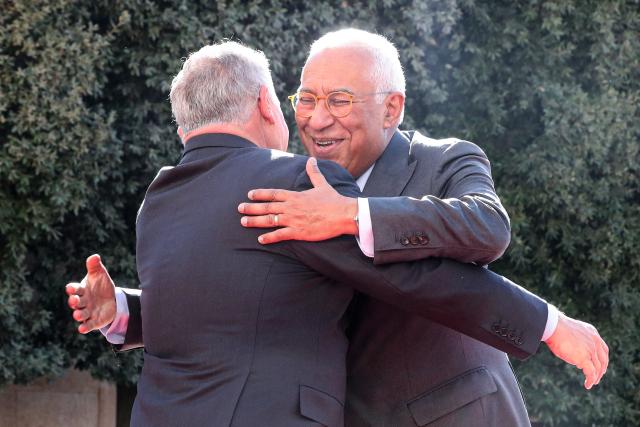 Jordan's King Abdullah II (L) greets European Council President Antonio Costa upon his arrival for the Jordanian-European summit, at the Al-Husseiniya Palace in Amman on January 8, 2026. The summit is to discuss political and economic cooperation between Jordan and the EU, and the latest regional and international developments. (Photo by Fabrice COFFRINI / AFP)