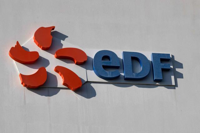 (FILES) A logo of French energy giant EDF is seen at the headquarters in Marseille, southern France, on October 10, 2025. EDF saw its nuclear electricity production increase in 2025 thanks to the good availability of its reactors, but its hydroelectric production declined due to lower rainfall, returning to normal after an exceptionally wet 2024. (Photo by Miguel MEDINA / AFP)