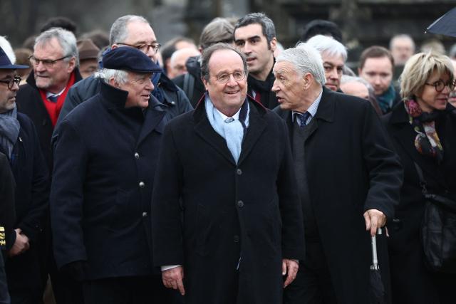 The youngest son of Francois Mitterrand, Gilbert Mitterrand (front, R) French former president Francois Hollande (front, C) and former Socialist minister Jean Glavany (front L) arrive to attend the ceremony marking the 30th anniversary of the death of French Socialist president Francois Mitterrand in Jarnac, on January 8, 2026. (Photo by ROMAIN PERROCHEAU / AFP)