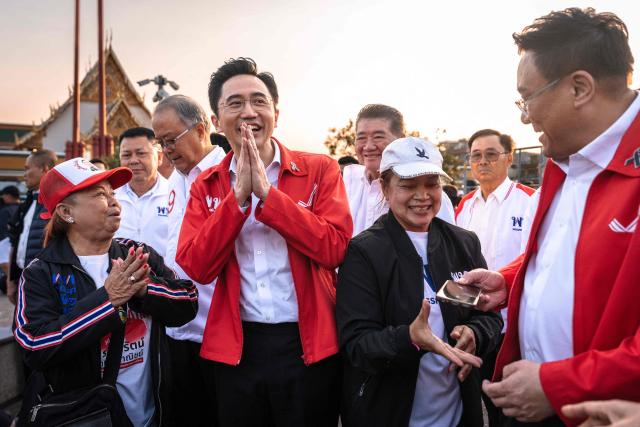 Pheu Thai Party prime ministerial candidate Yodchanan Wongsawat (C) greets supporters during the party’s first major rally at Lan Khon Mueang in Bangkok on January 8, 2025. (Photo by Chanakarn Laosarakham / AFP)