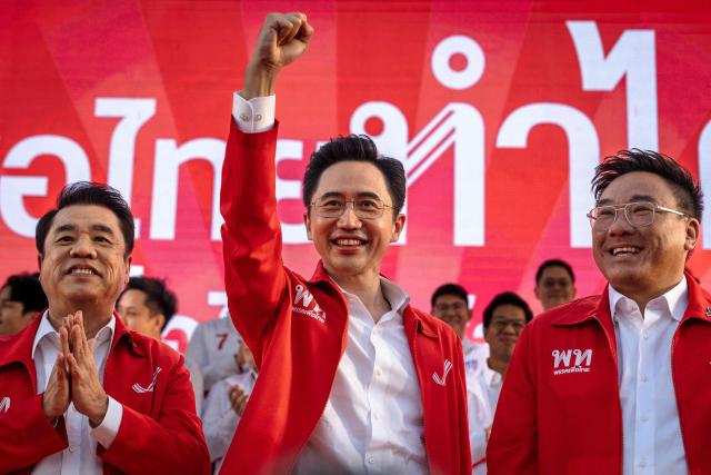 Pheu Thai Party prime ministerial candidate Yodchanan Wongsawatraised (C) attends the party’s first major rally at Lan Khon Mueang in Bangkok on January 8, 2025. (Photo by Chanakarn Laosarakham / AFP)