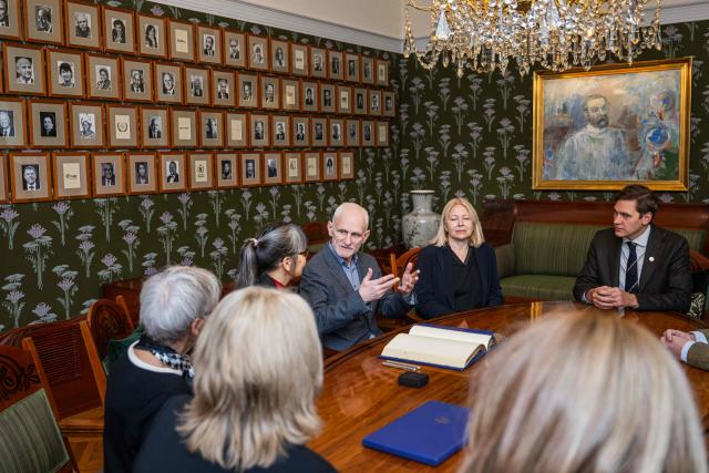 Belarusian human rights activist and 2022 Nobel Peace Prize laureate Ales Bialiatski (C) and his wife Natallia Pinchuk are seated with the Norwegian Nobel Committee members at the Nobel Institute in Oslo on January 8, 2026. (Photo by Jonathan NACKSTRAND / AFP)