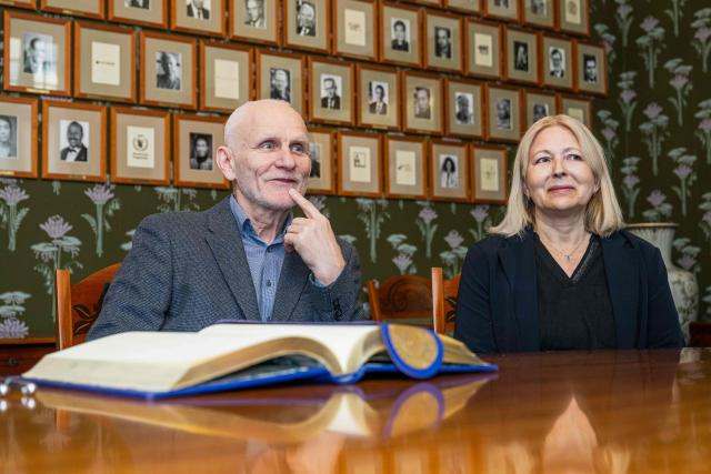 Belarusian human rights activist and 2022 Nobel Peace Prize laureate Ales Bialiatski and his wife Natallia Pinchuk are seated with the Norwegian Nobel Committee members at the Nobel Institute in Oslo on January 8, 2026. (Photo by Jonathan NACKSTRAND / AFP)