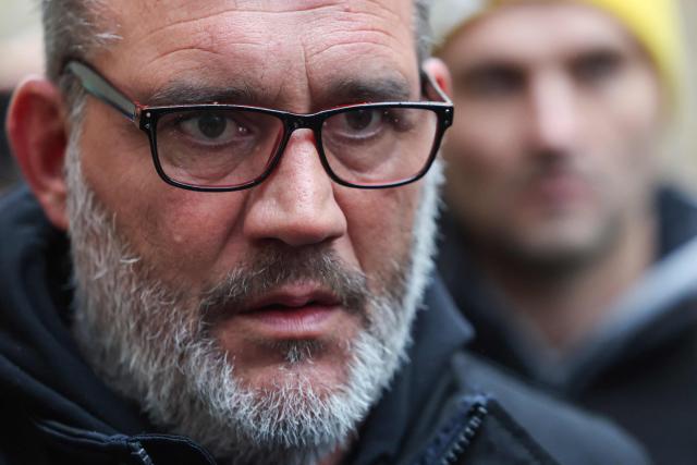 Head of farmers' union Coordination Rurale (CR) Bertrand Venteau speaks to the press as he arrives at the France´s National Assembly for an audition with its president during a demonstration of French agricultural union Coordination Rurale (CR) as part of a nationwide day of protests and actions called by several farmers unions to push the French government to block the Mercosur trade deal and protest against its handling of the nodular dermatitis (CND) epidemic, in Paris on January 8, 2026. (Photo by Ludovic MARIN / AFP)