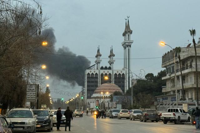 Columns of smoke rise from the site of artillery shelling that targeted the area near Aleppos Abdelrahman Mosque on January 8, 2026, amid intense clashes between government forces and the Kurdish Syrian Democratic Forces (SDF) forces. Syria's military warned civilians in two besieged Kurdish neighbourhoods in the city of Aleppo to leave on December 8, as it prepared to conduct a fresh wave of strikes targeting Kurdish positions. Thousands have already fled the area following clashes between the army and Kurdish-led forces that have killed more than a dozen people. (Photo by Omar HAJ KADOUR / AFP)