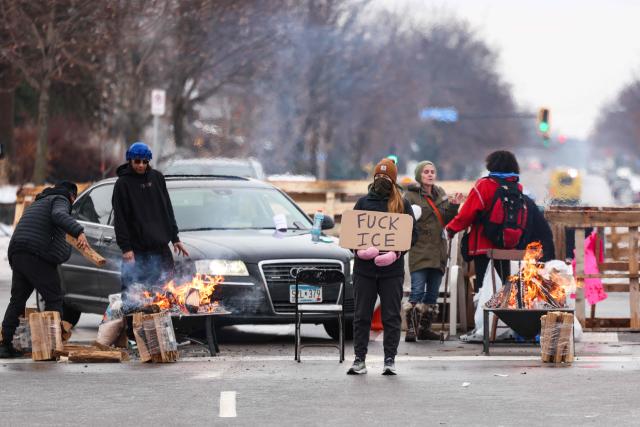 Demonstrators gather at the street where 37-year-old Renee Nicole Good was shot and killed at point blank range on January 7 by a US Immigration and Customs Enforcement (ICE) agent as she apparently tried to drive away from agents who were crowding around her car, in Minneapolis, Minnesota, on January 8, 2026. A US Immigration and Customs Enforcement (ICE) agent shot and killed an American woman on the streets of Minneapolis January 7, leading to huge protests and outrage from local leaders who rejected White House claims she was a domestic terrorist. (Photo by CHARLY TRIBALLEAU / AFP)