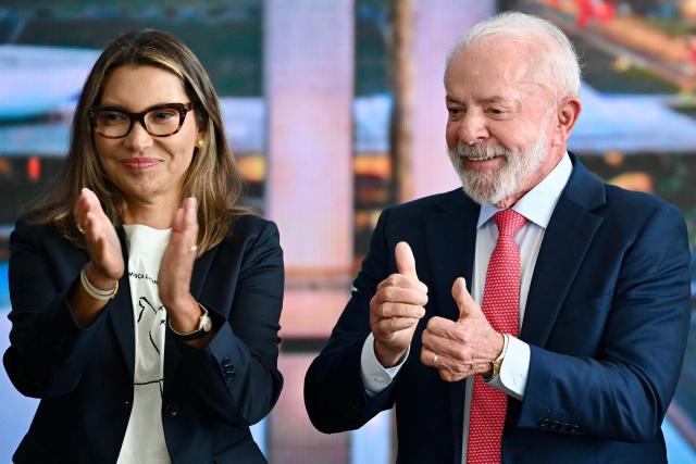 Brazil’s President Luiz Inacio Lula da Silva and First Lady Rosangela 'Janja' Da Silva gesture during the Ceremony in Defense of Democracy marking the third anniversary of the attempted coup d'йtat involving the invasion and destruction of buildings of the three branches of government, at the Planalto Palace in Brasнlia, on January 8, 2026. (Photo by Evaristo Sa / AFP)