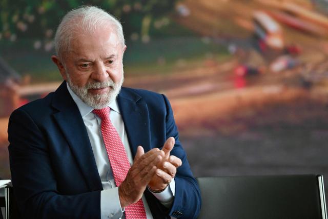 Brazil’s President Luiz Inacio Lula da Silva applauds during the Ceremony in Defense of Democracy marking the third anniversary of the attempted coup d'йtat involving the invasion and destruction of buildings of the three branches of government, at the Planalto Palace in Brasнlia, on January 8, 2026. (Photo by Evaristo Sa / AFP)