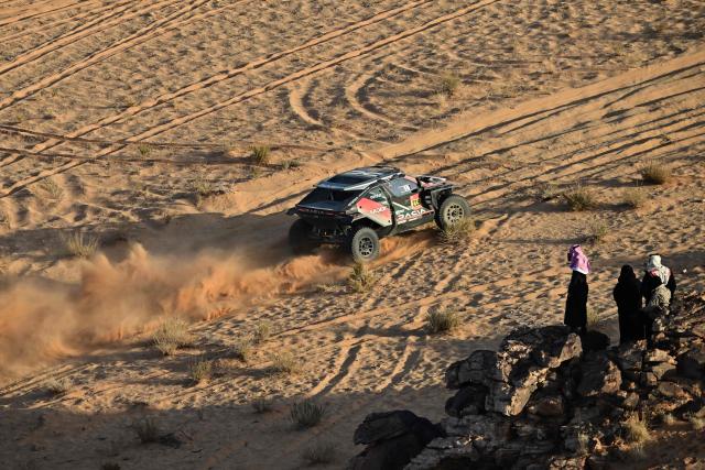 The Dacia Sandriders’s French driver Sebastien Loeb and French co-pilot Edouard Boulanger compete in the Stage 5 of the 48th edition of the Dakar Rally 2026, between Al-Ula and Hail, Saudi Arabia, on January 8, 2026. (Photo by Giuseppe CACACE / AFP)