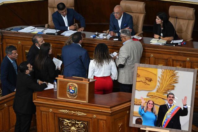 The President of the National Assembly of Venezuela Jorge Rodriguez speaks with congresspeople during the National Assembly session in Caracas on January 8, 2026. Rodriguez announced the imminent release of a significant number of Venezuelans and foreign nationals "in order to contribute to and collaborate in the effort that we must all make to achieve coexistence". (Photo by Federico PARRA / AFP)