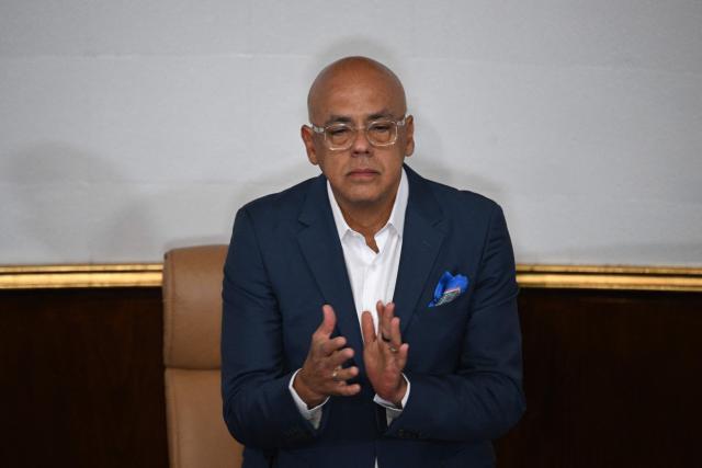 The President of the National Assembly of Venezuela Jorge Rodriguez applauds during the National Assembly session in Caracas on January 8, 2026. Rodriguez announced the imminent release of a significant number of Venezuelans and foreign nationals "in order to contribute to and collaborate in the effort that we must all make to achieve coexistence". (Photo by Federico PARRA / AFP)