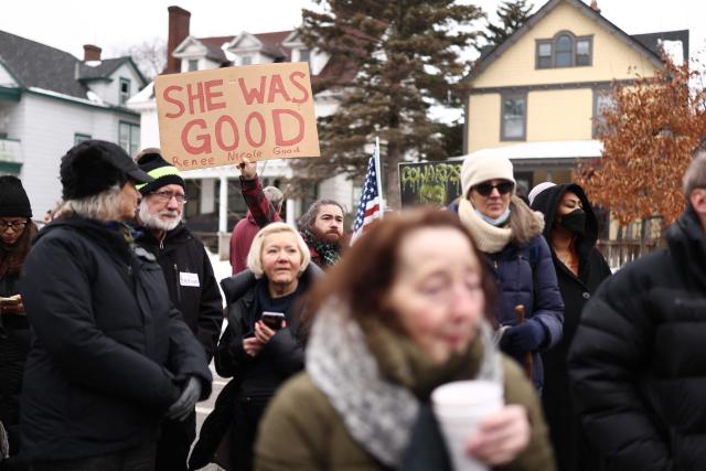 Demonstrators gather at the street where 37-year-old Renee Nicole Good was shot and killed at point blank range on January 7 by a US Immigration and Customs Enforcement (ICE) agent as she apparently tried to drive away from agents who were crowding around her car, in Minneapolis, Minnesota, on January 8, 2026. A US Immigration and Customs Enforcement (ICE) agent shot and killed an American woman on the streets of Minneapolis January 7, leading to huge protests and outrage from local leaders who rejected White House claims she was a domestic terrorist. The woman, identified in local media as 37-year-old Renee Nicole Good, was hit at point blank range as she apparently tried to drive away from agents who were crowding around her car, which they said was blocking their way. (Photo by CHARLY TRIBALLEAU / AFP)