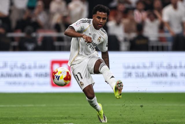 Real Madrid's Brazilian forward #11 Rodrygo kicks the ball during the Spanish Supercup semi-final football match between Atletico Madrid and Real Madrid at King Abdullah Sports City in Jeddah on January 8, 2026. (Photo by Fadel SENNA / AFP)