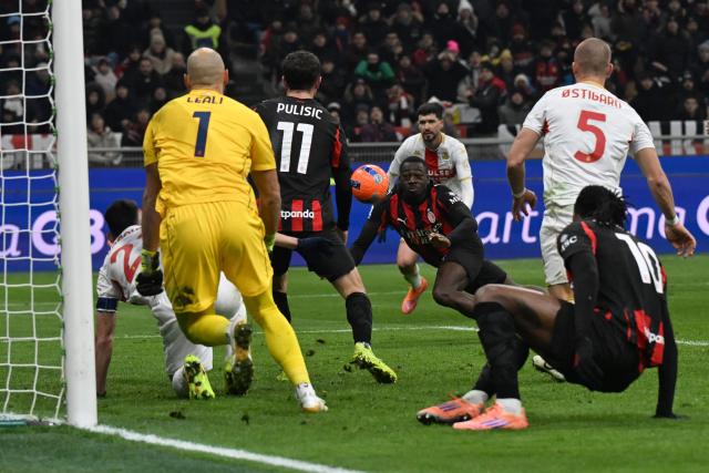 AC Milan's French midfielder #19 Youssouf Fofana (C) heads the ball during the Italian Serie A football match between AC Milan and Genoa at San Siro stadium in Milan, northern Italy, on January 8, 2025. (Photo by Stefano Rellandini / AFP)