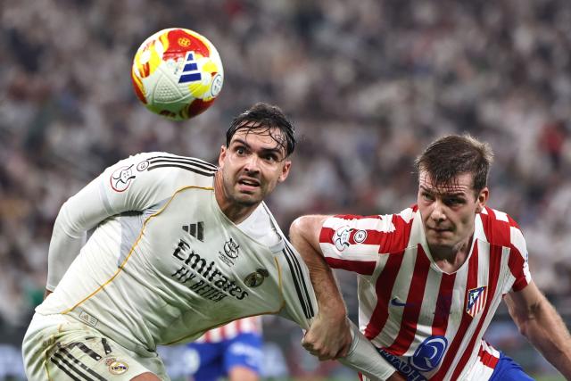 Atletico Madrid's Slovak defender #17 David Hancko fights for the ball with Atletico Madrid's Norwegian forward #09 Alexander Sorloth during the Spanish Supercup semi-final football match between Atletico Madrid and Real Madrid at King Abdullah Sports City in Jeddah on January 8, 2026. (Photo by Fadel SENNA / AFP)