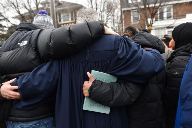 Clergy, faith and community leaders gather to call for ICE to leave the community following the fatal shooting of Renee Good during a law enforcement operation in Minneapolis, Minnesota, on January 8, 2026. A US Immigration and Customs Enforcement (ICE) agent shot and killed an American woman on the streets of Minneapolis January 7, leading to huge protests and outrage from local leaders who rejected White House claims she was a domestic terrorist. The woman, identified in local media as 37-year-old Renee Nicole Good, was hit at point blank range as she apparently tried to drive away from agents who were crowding around her car, which they said was blocking their way. (Photo by Octavio JONES / AFP)
