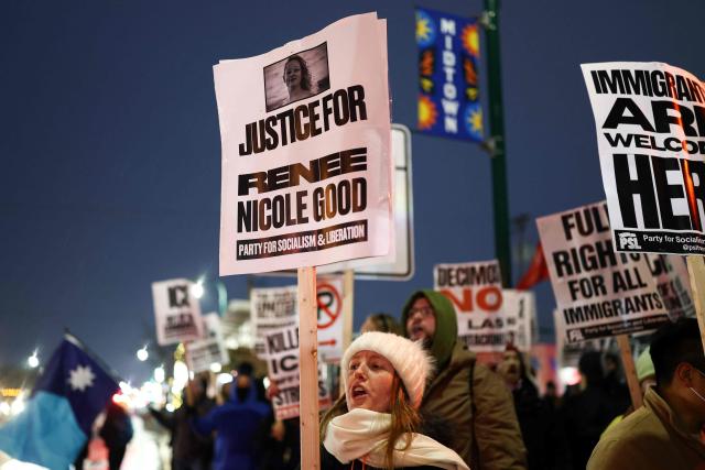 People hold signs demanding justice for Renee Nicole Good during a "Stop ICE Terror" emergency protest in Minneapolis, Minnesota, on January 8, 2026. A US Immigration and Customs Enforcement (ICE) agent shot and killed an American woman on the streets of Minneapolis January 7, leading to huge protests and outrage from local leaders who rejected White House claims she was a domestic terrorist. The woman, identified in local media as 37-year-old Renee Nicole Good, was hit at point blank range as she apparently tried to drive away from agents who were crowding around her car, which they said was blocking their way. (Photo by CHARLY TRIBALLEAU / AFP)