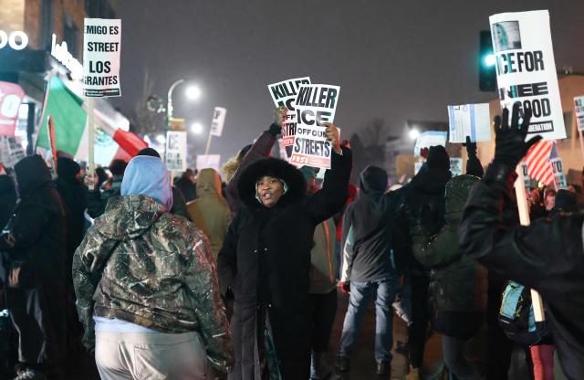 A woman holds a sign reading "Killer ICE Out of Our Streets" during a "Stop ICE Terror" emergency protest in Minneapolis, Minnesota, on January 8, 2026. A US Immigration and Customs Enforcement (ICE) agent shot and killed an American woman on the streets of Minneapolis January 7, leading to huge protests and outrage from local leaders who rejected White House claims she was a domestic terrorist. The woman, identified in local media as 37-year-old Renee Nicole Good, was hit at point blank range as she apparently tried to drive away from agents who were crowding around her car, which they said was blocking their way. (Photo by CHARLY TRIBALLEAU / AFP)