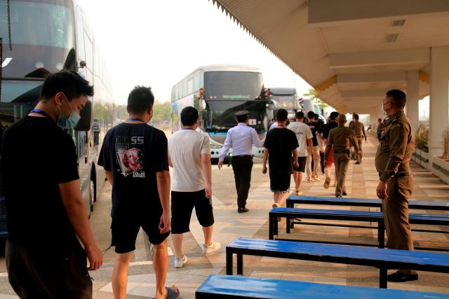 (FILES) Alleged scam centre workers and victims from China arrive at the border checkpoint with Thailand in Myanmar's eastern Myawaddy township on February 20, 2025. China is moving against the cyberscam tycoons making fortunes in Southeast Asia, driven by mounting public pressure and Beijing's desire to keep control of judicial processes, analysts say. 
In 2025, a series of crackdowns largely driven by Beijing -- which wields significant economic and diplomatic influence in the region -- saw thousands of workers released from scam centres in Myanmar and Cambodia and repatriated to their home countries, many of them to China.
Now Beijing has turned its focus to the bosses at the apex of the criminal pyramids, netting its biggest player so far with the arrest and extradition of Chen Zhi from Cambodia in January 2026. (Photo by AFP)