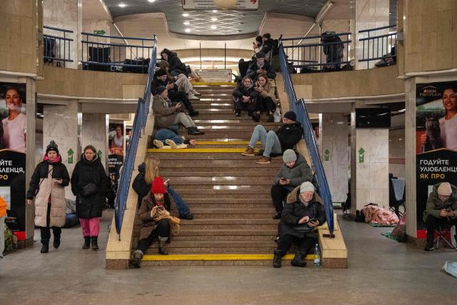 People take shelter at a metro station during Russian drone and missile attacks in Kyiv early on January 9, 2026, amid the Russian invasion of Ukraine. (Photo by Serhii Okunev / AFP)