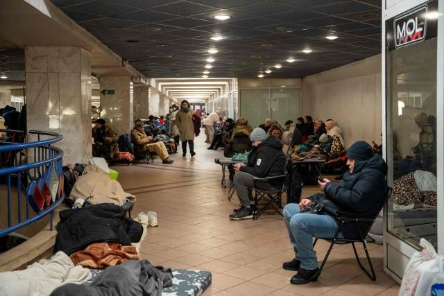 People take shelter at a metro station during Russian drone and missile attacks in Kyiv early on January 9, 2026, amid the Russian invasion of Ukraine. (Photo by Serhii Okunev / AFP)