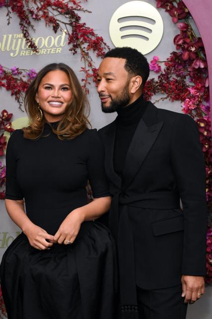 US singer-songwriter John Legend and his wife Chrissy Teigen attend the Hollywood Reporter and Spotify Golden Globe nominees night at The Lot at Formosa in Los Angeles on January 8, 2026. (Photo by Unique Nicole / AFP)