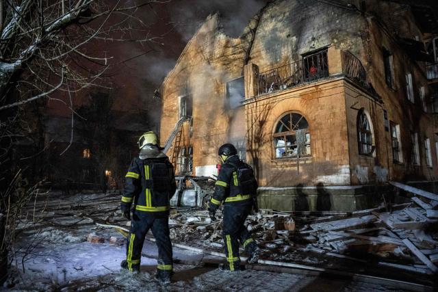 Ukrainian rescuers work to extinguish a fire in a heavily damaged residential building following a Russian drone and missile attacks in Kyiv early on January 9, 2026, amid the Russian invasion of Ukraine. (Photo by Serhii Okunev / AFP)