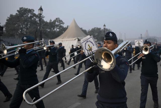 Indian Air Force band members participate in a rehearsal ahead of the Republic Day parade, on a cold winter morning in New Delhi on January 9, 2026. (Photo by Arun SANKAR / AFP)