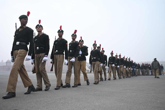 National Cadet Corps' (NCC) personnel participate in a rehearsal ahead of the Republic Day parade, on a cold winter morning in New Delhi on January 9, 2026. (Photo by Arun SANKAR / AFP)