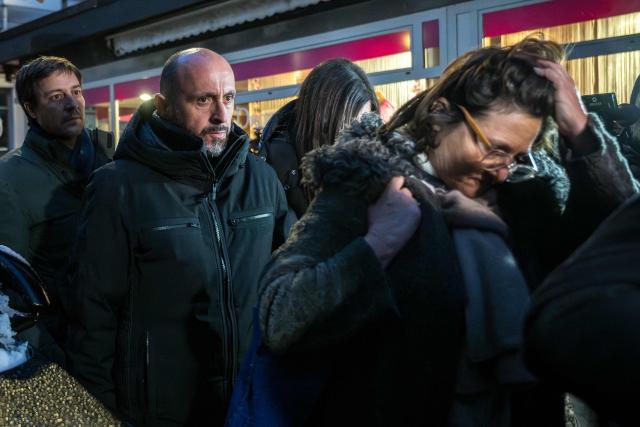 Owner of "Le Constellation" bar Jacques Moretti (2nd L) and lawyer Yael Hayat (R) arrive for a hearing at the Office of the public prosecutor of the Canton of Valais in Sion on January 9, 2026. The French couple, facing charges of manslaughter by negligence, bodily harm by negligence and arson by negligence, have been called in for questioning after 40 people, most of them teenagers, were killed, while 116 were injured in a he fire that ripped through a bar in the luxury Alpine ski resort of Crans-Montana on New Year's Eve. (Photo by Fabrice COFFRINI / AFP)