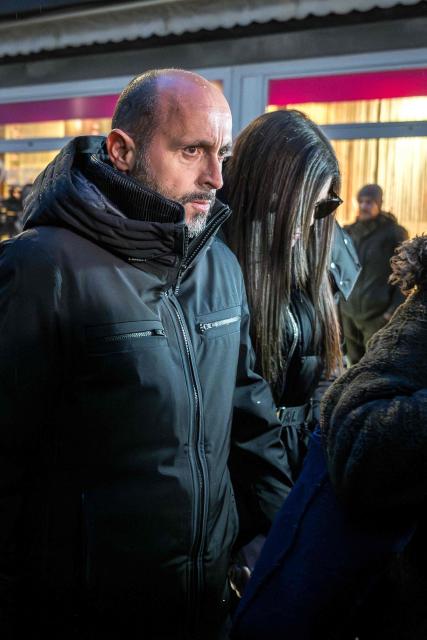 Owners of Le Constellation bar Jacques Moretti (L) and Jessica Moretti (rear R) arrive for a hearing at the Office of the public prosecutor of the Canton of Valais, in Sion, on January 9, 2026. The French couple, facing charges of manslaughter by negligence, bodily harm by negligence and arson by negligence, have been called in for questioning after 40 people, most of them teenagers, were killed, while 116 were injured in a fire that ripped through a bar in the luxury Alpine ski resort of Crans-Montana on New Year's Eve. (Photo by Fabrice COFFRINI / AFP)