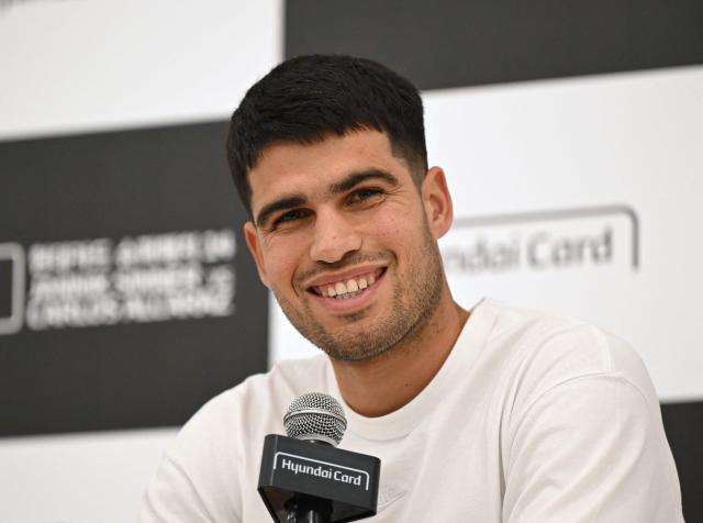 Spain's Carlos Alcaraz speaks during a press conference at Hyundai Card headquarters in Seoul on January 9, 2026, ahead of a tennis exhibition match between Jannik Sinner and Carlos Alcaraz. (Photo by Jung Yeon-je / AFP)