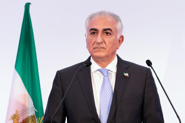 (FILES) Iranian opposition leader and son of the last shah of Iran Mohammad Reza Pahlavi, Reza Pahlavi holds a press conference in Paris on June 23, 2025. The son of the shah of Iran ousted by the 1979 Islamic Revolution, US-based Reza Pahlavi, who had called for major protests on January 8, 2026, meanwhile urged a new show of force in the streets on Januray 9. Iranians staged their biggest protests yet of an almost two week movement sparked by anger over the rising cost of living, chanting slogans including "death to the dictator" and setting fire to official buildings, videos showed. 

. (Photo by JOEL SAGET / AFP)