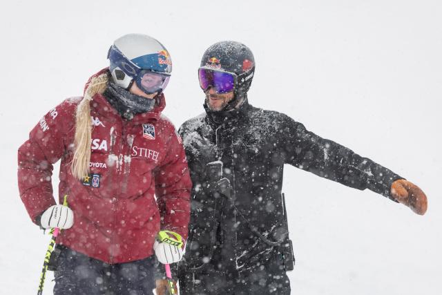 US' Lindsey Vonn and Norway's Aksel Lund Svindal are pictured after the cancellation of the second training for the women's downhill race of the FIS Alpine Ski World Cup in Zauchensee, Austria on January 9, 2026. (Photo by Johann GRODER / APA / AFP) / Austria OUT