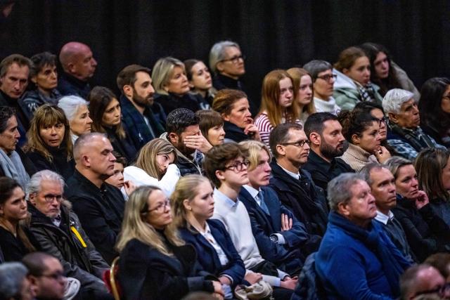 Families and relatives of the victims attend a tribute ceremony for the victims of the deadly fire that ripped through the bar Le Constellation on New Year's Eve, in Crans-Montana on January 9, 2026. All of Switzerland will mark a national day of mourning on January 9 for the dozens of mostly teenagers killed when fire ravaged a ski resort bar crammed with New Year revellers. Just over a week after the tragedy at the Le Constellation bar in Crans-Montana, which left 40 dead and 116 injured, the wealthy Alpine nation will come to a standstill for a minute of silence at 2:00 pm (1300 GMT). (Photo by MAXIME SCHMID / AFP)