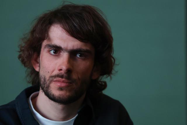 Groupama-FDJ French rider Guillaume Martin-Guyonnet reacts during his cycling team's 2026 presentation in Paris, on January 9, 2026. (Photo by Anne-Christine POUJOULAT / AFP)