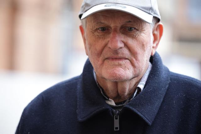 Jean-Paul, a 70-year-old man who smashed an egg on Rassemblement National's far-right politician Jordan Bardella's head in Moissac, looks on ahead of his trial, in front of the courthouse in Montauban, southwestern France on January 9, 2026. (Photo by Valentine CHAPUIS / AFP)