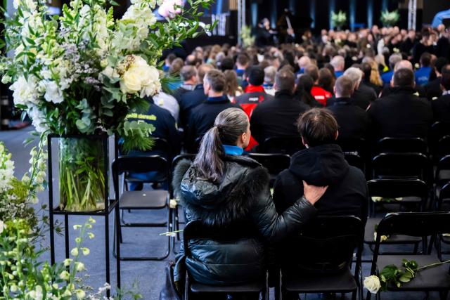 Relatives of victims react after a tribute ceremony for the victims of the deadly fire that ripped through the bar Le Constellation in Crans-Montana on New Year's Eve, in Martigny, on January 9, 2026. All of Switzerland will mark a national day of mourning on January 9 for the dozens of mostly teenagers killed when fire ravaged a ski resort bar crammed with New Year revellers. Just over a week after the tragedy at the Le Constellation bar in Crans-Montana, which left 40 dead and 116 injured, the wealthy Alpine nation will come to a standstill for a minute of silence at 2:00 pm (1300 GMT). (Photo by LAURENT GILLIERON / POOL / AFP)